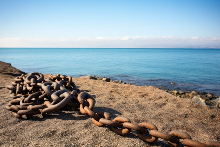 view of the ships anchor chain with the sea in the background, created with generative aiの素材