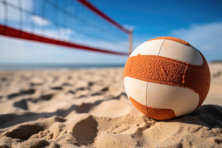 a close-up shot of a volleyball on sandy beach with a net in the background, created with generative aiの素材