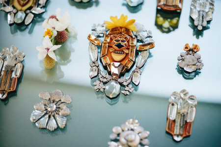 crystal brooches arranged on mirrored surfaceの素材