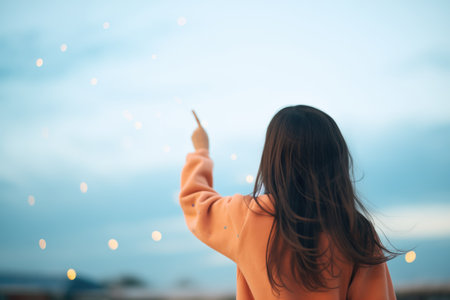 girl pointing at a constellation in the skyの素材