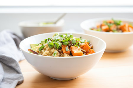sweet potato and quinoa bowl with green onionsの素材