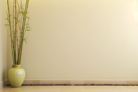 bamboo shoots in a vase beside spa space with a blank wallの素材