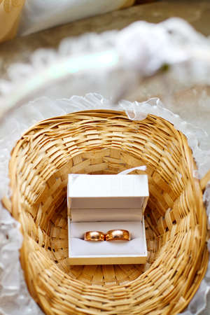 wedding ring in a basket made ââof strawの写真素材