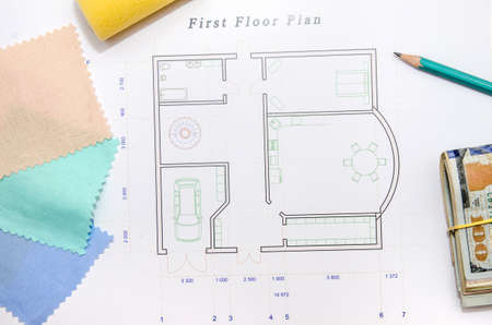 architectural drawings with cloth sample and brush , dollars, pen as background