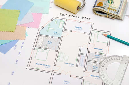 architectural drawings with cloth sample and brush , dollars, pen as backgroundの写真素材