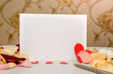 Red rose petals and blank gift card for textの写真素材