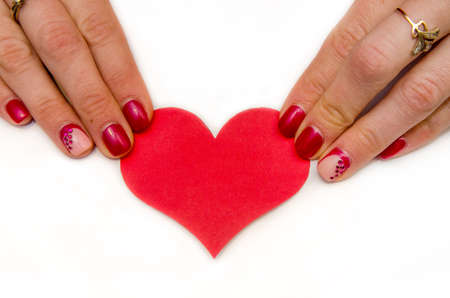 Woman hands holading red paper heartの写真素材