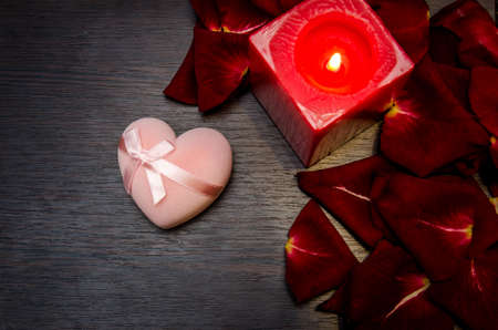 candle, red petal rose with gift box on table. valentine concept backgroundの写真素材