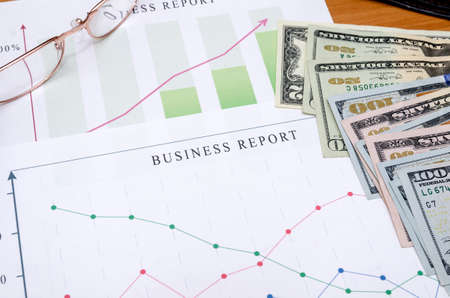 financial data concept with pen and glassesの写真素材