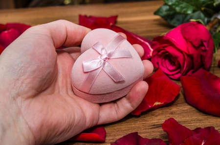 Romantic Gift and Rose with petal on tableの写真素材