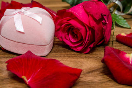 Romantic Gift and Rose with petal on tableの写真素材