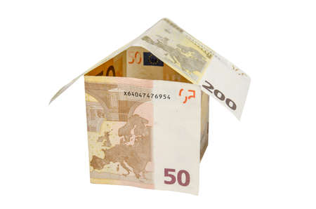 house made from euro bills isolated on white backgroundの写真素材