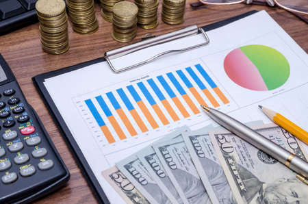 graph with tablet pc and moneyの写真素材