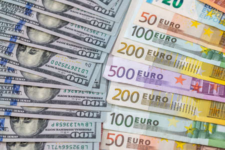 many dollar and euro banknote as background.の写真素材