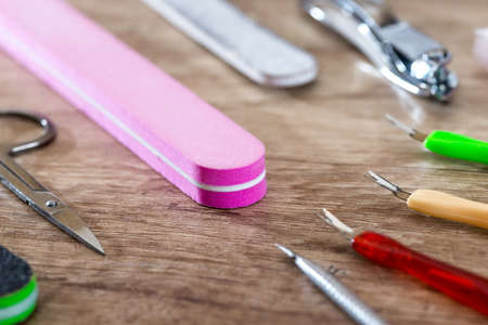 nail scissors file and clippers to remove the cuticle on desk.の写真素材