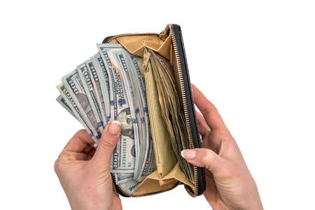 business woman holding cash in purse, isolated on white.の写真素材