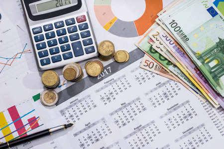 business concept - euros bills, calendar, pen and calculator.の写真素材