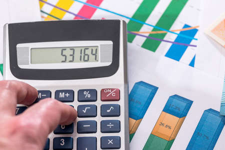 business graph with calculator. business concept. close up.の写真素材