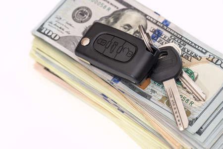 car key with us dollar on white backgroundsの写真素材
