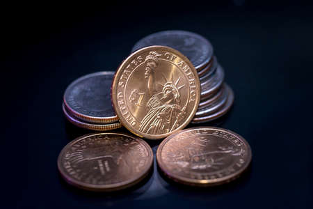 us coin dollar isolated on black background.の写真素材