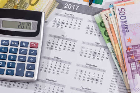 2017 calendar with euro bills with calculator pen