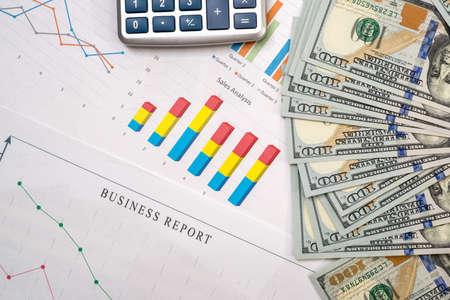 calculator, dollar banknote and business chartの写真素材