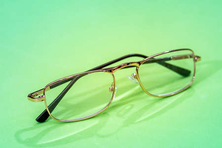 Glasses isolated on green background close upの写真素材