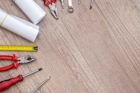 different epair tools on wooden desk and place for textの写真素材