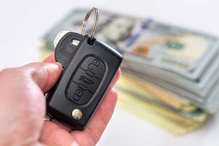car key with us dollar on white backgroundsの写真素材