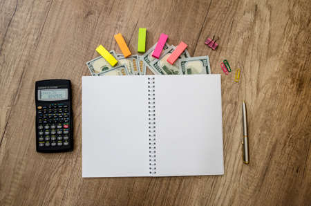 Set - calculator, notepad with pen and us dollarsの写真素材