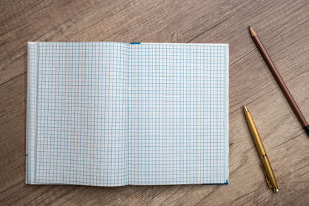 empty notepad with pen on desk
