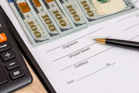 blank contract, pen and us dollar