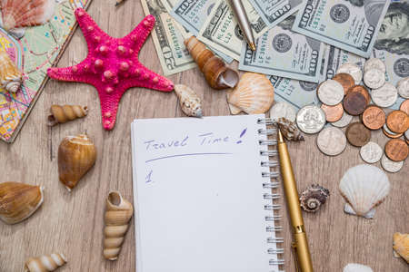 set for travel and vacation - money, shell, map, notepad and penの写真素材