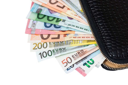 euro banknotes in leather black purse isolated on white background