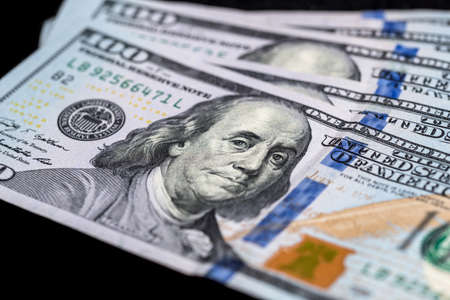 US Dollars isolated on black background