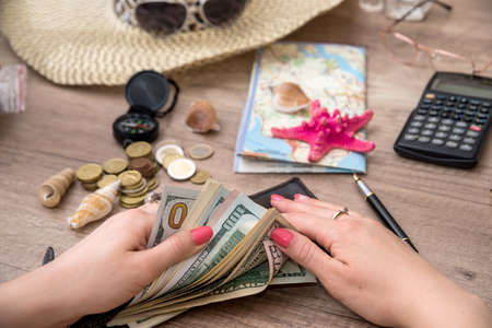 trip accessories - empty notepad, money, map and compassの写真素材