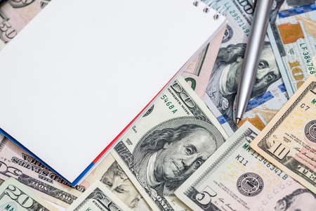 us dollar with pen and notepadの写真素材
