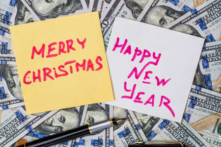 text merry christmas and Happy New Year on dollarの写真素材