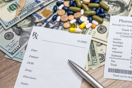 Cost of medicine - blank, money and pen