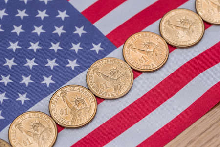 close up of american flag and cent coins, nationalism concept.の写真素材