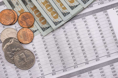 Utility bill with us coin and dollar banknotes.の写真素材