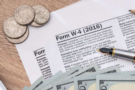 2017 tax form - w4 with money.の写真素材