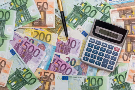 pen calculator and euro banknotes. close upの写真素材