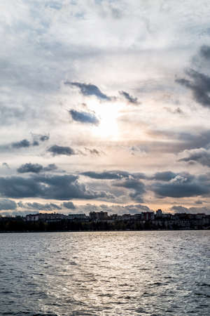 dramatic sunset sky at the lake in cityの写真素材