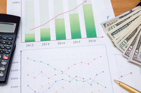 business graphic with money, calculator, pen