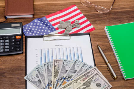 Business concept with graph, calculator, money with usa flagの写真素材