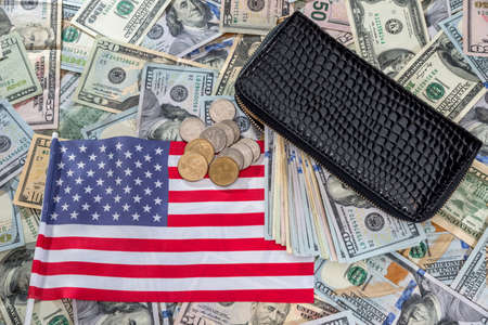 usa dollar in purse on usa flag.の写真素材