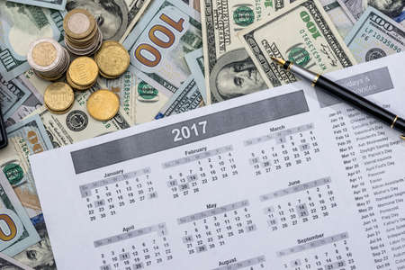 dollar banknote with calendar and calculator.