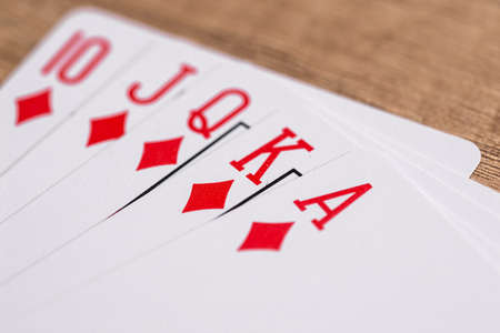 Set of Diamonds suit playing cards on wooden deskの写真素材