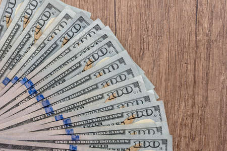 american dollar bills on wooden deskの写真素材